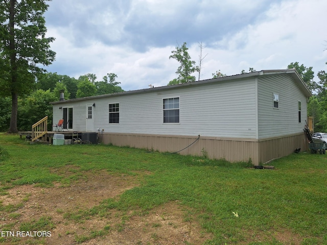 back of house with a yard