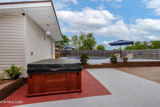 view of patio featuring a hot tub