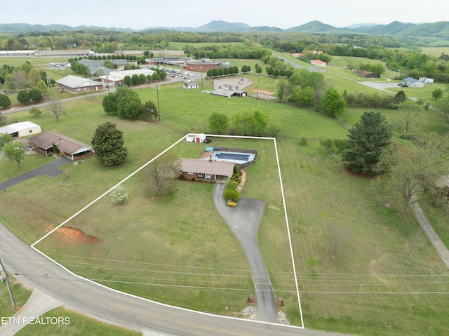 drone / aerial view featuring a rural view and a mountain view