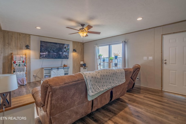 living room with recessed lighting, ornamental molding, a ceiling fan, and wood finished floors