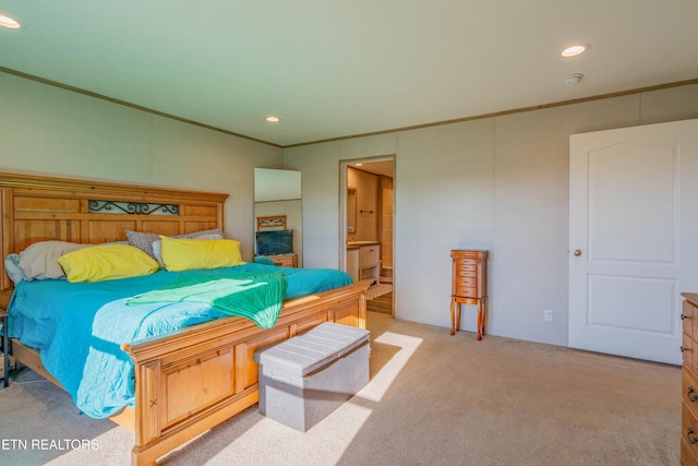 carpeted bedroom featuring recessed lighting, ensuite bath, and crown molding