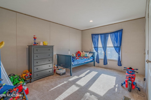 bedroom featuring crown molding, carpet, and visible vents