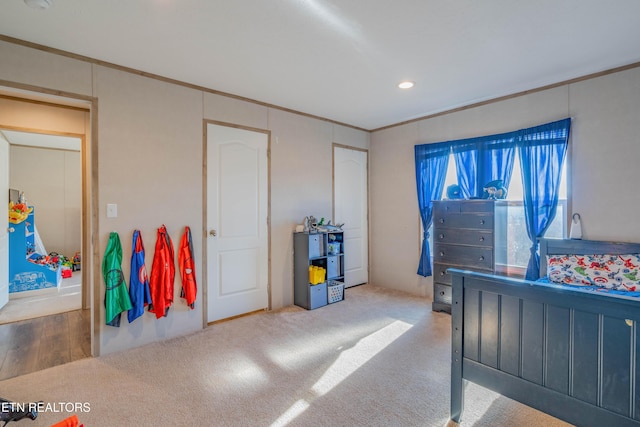 bedroom with recessed lighting and ornamental molding