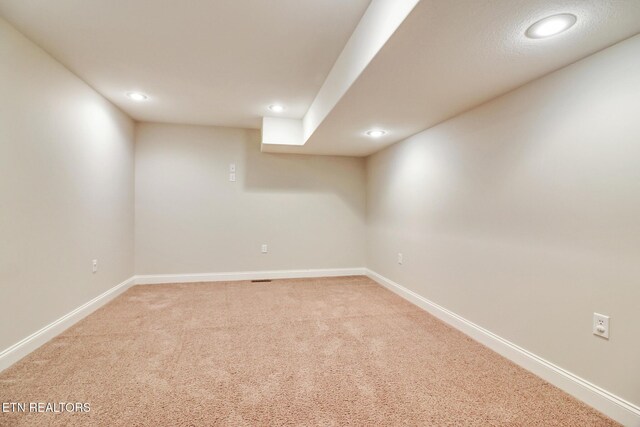 basement with carpet flooring