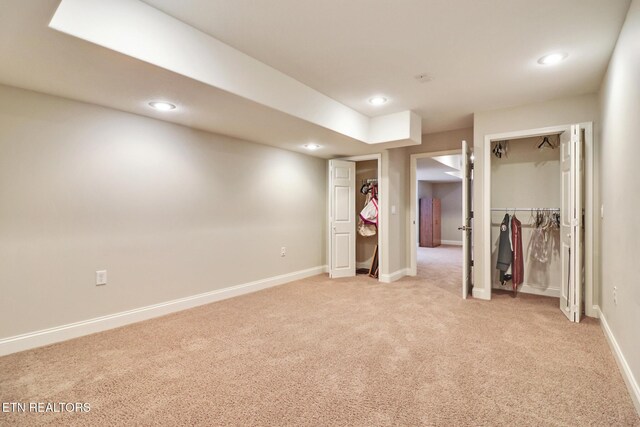 unfurnished bedroom featuring light carpet