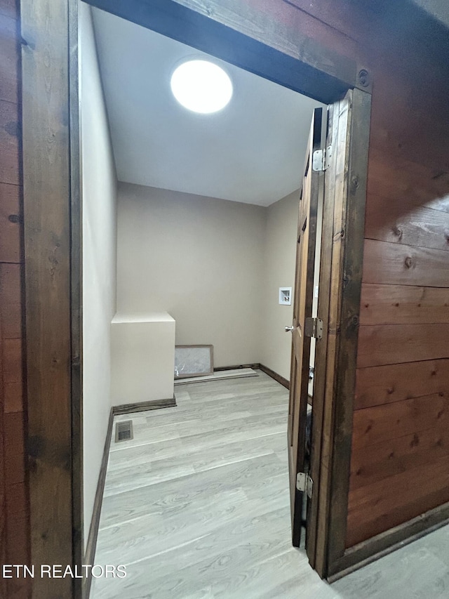 corridor featuring light hardwood / wood-style floors