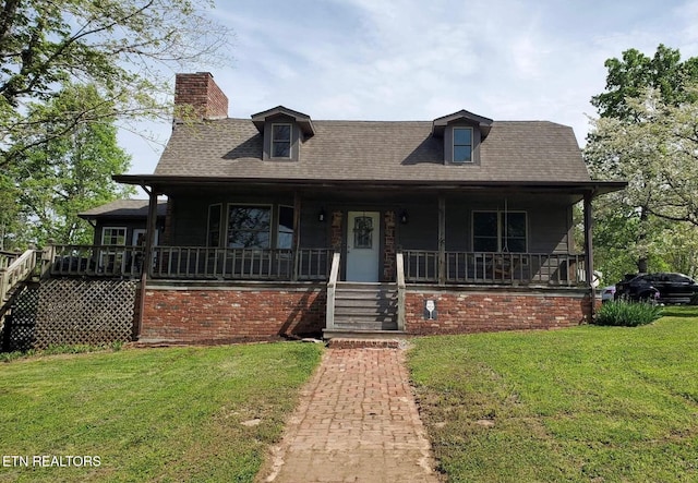 view of front of home featuring a front yard and a porch