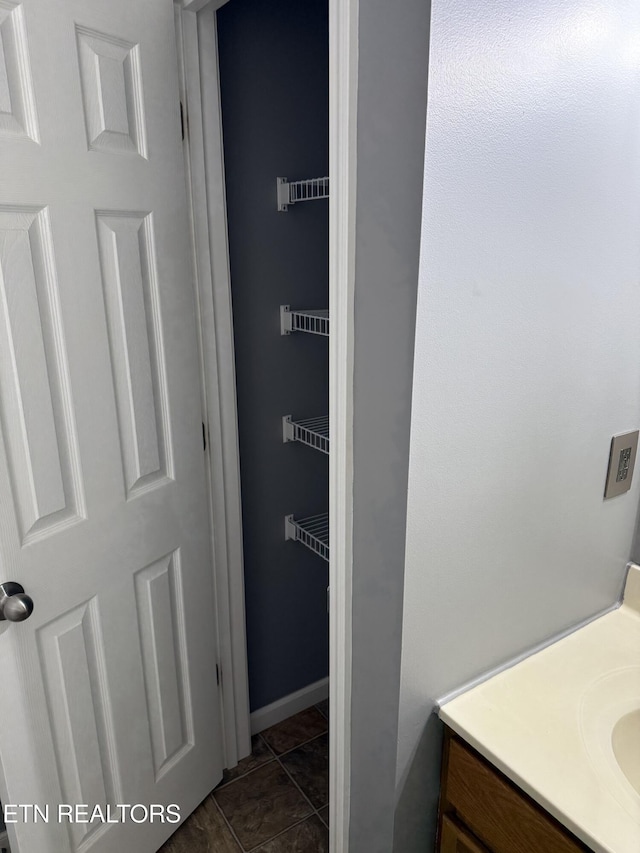 bathroom featuring tile patterned floors and vanity