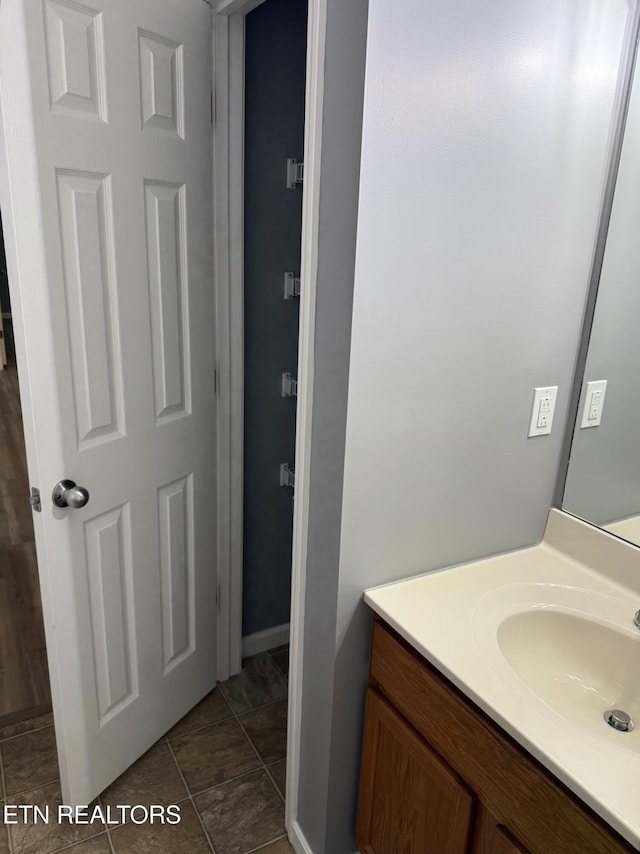 bathroom featuring tile patterned floors and vanity