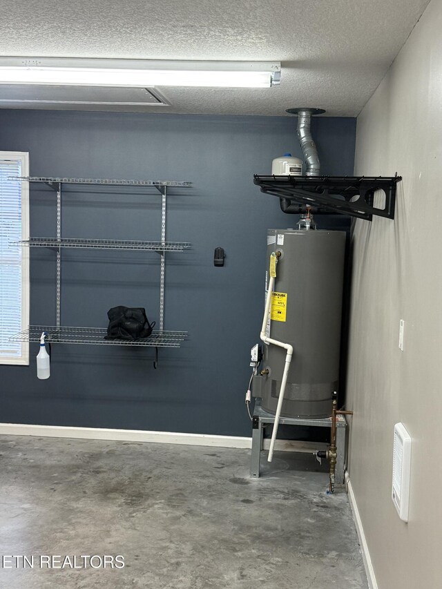 utility room with water heater