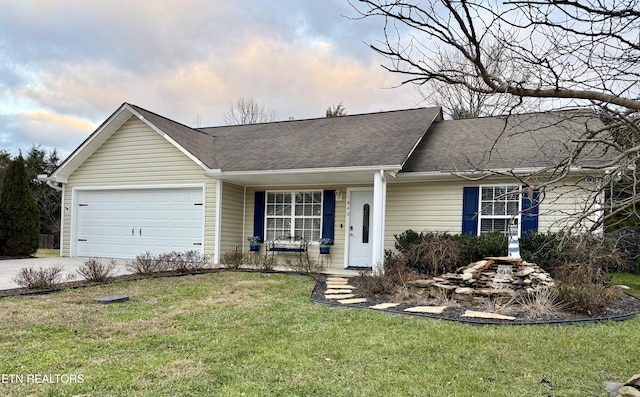 ranch-style home with a front lawn and a garage