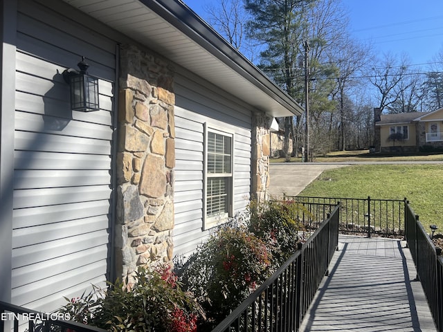 view of side of home featuring a yard