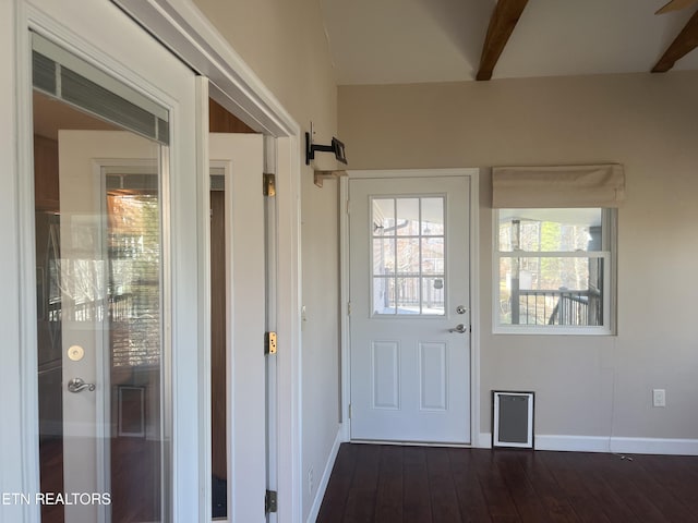 entryway featuring beam ceiling and dark wood-type flooring