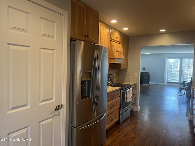 kitchen featuring tasteful backsplash, dark hardwood / wood-style flooring, and stainless steel appliances