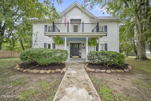 view of front of house with a balcony