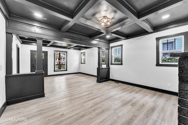 interior space with coffered ceiling, light wood-type flooring, and decorative columns