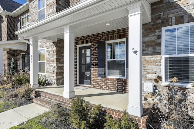 doorway to property featuring covered porch