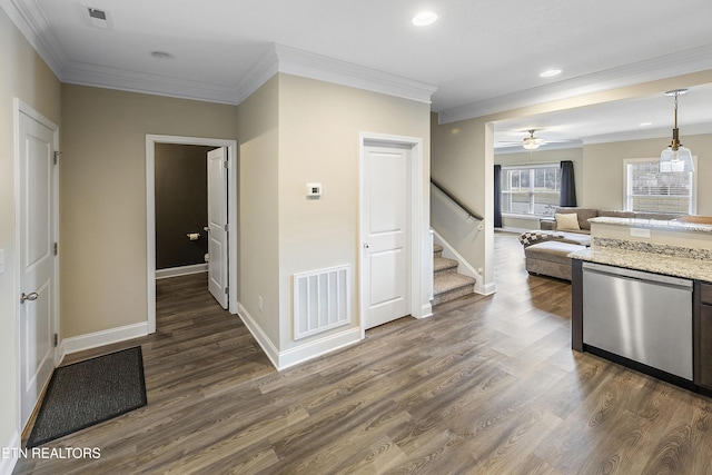 kitchen with dark hardwood / wood-style flooring, light stone counters, crown molding, dishwasher, and hanging light fixtures