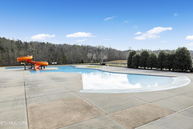 view of swimming pool with a patio