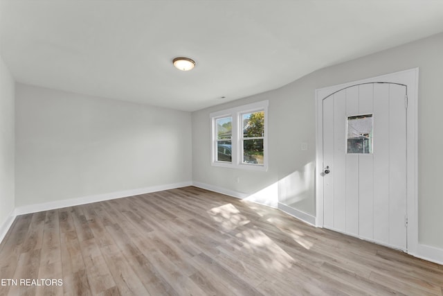 foyer entrance with light hardwood / wood-style floors