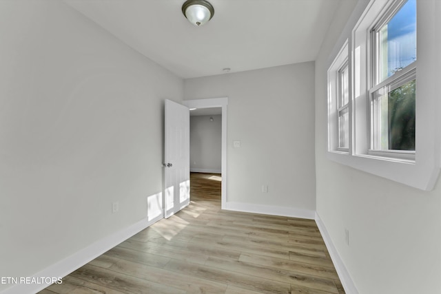 spare room featuring light hardwood / wood-style flooring