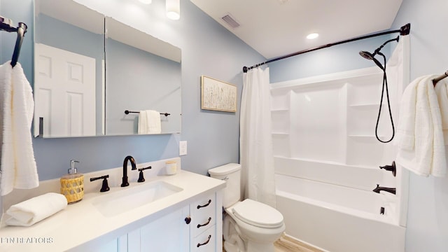 bathroom with toilet, visible vents, shower / bath combination with curtain, and vanity