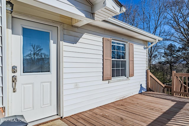 view of exterior entry featuring a deck