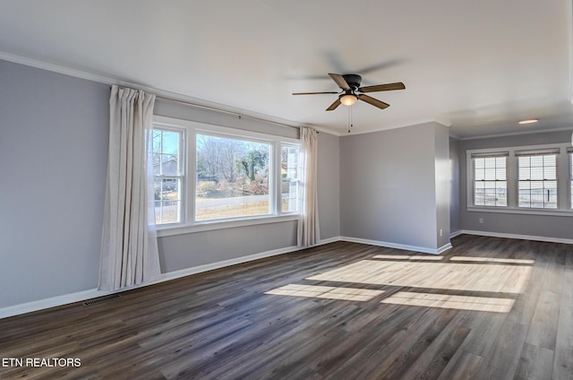 unfurnished room featuring ceiling fan, dark hardwood / wood-style flooring, and crown molding