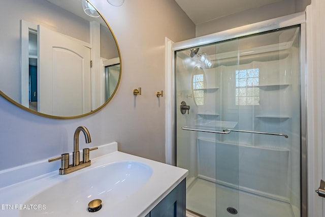 bathroom with vanity and walk in shower