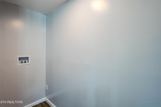 laundry room with washer hookup and hardwood / wood-style floors