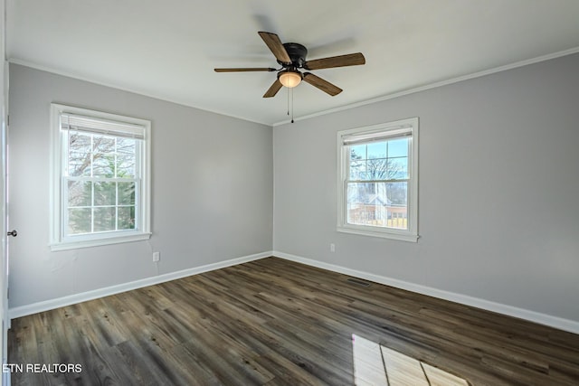 unfurnished room with crown molding, plenty of natural light, dark wood-type flooring, and ceiling fan