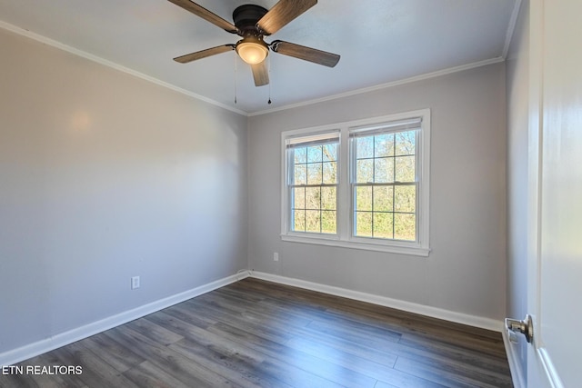 spare room featuring crown molding, ceiling fan, and dark wood-type flooring