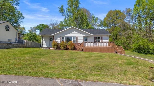 single story home featuring a deck, a front yard, fence, and stairway