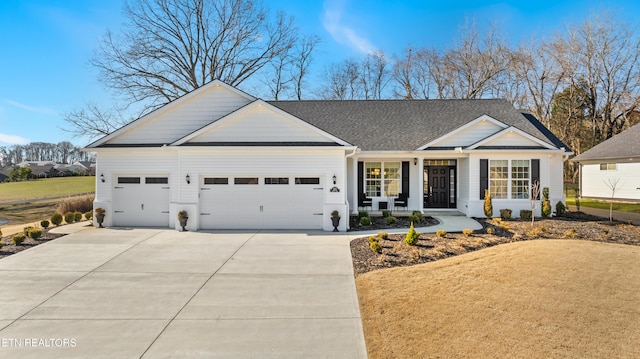 ranch-style home with covered porch and a garage