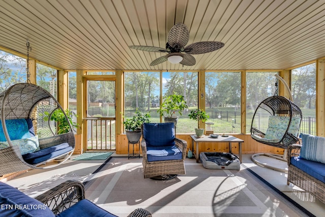 sunroom featuring ceiling fan