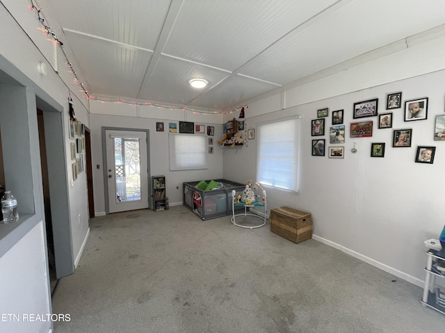 interior space featuring light carpet