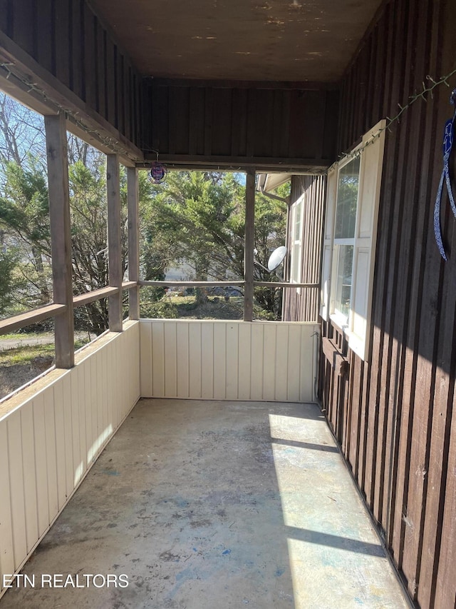 unfurnished sunroom with plenty of natural light