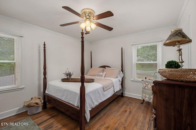 bedroom with dark hardwood / wood-style flooring, ceiling fan, and ornamental molding