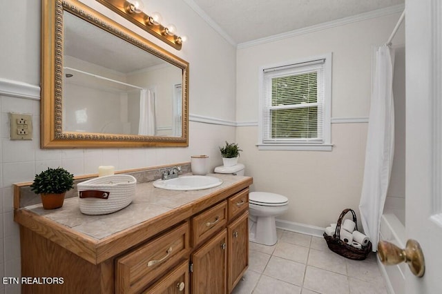 full bathroom featuring tile patterned flooring, crown molding, toilet, vanity, and shower / tub combo