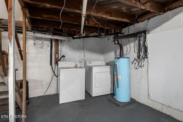 basement with washing machine and dryer and water heater