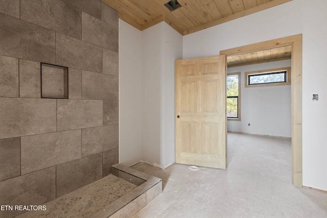 bathroom featuring lofted ceiling, wood ceiling, and concrete flooring