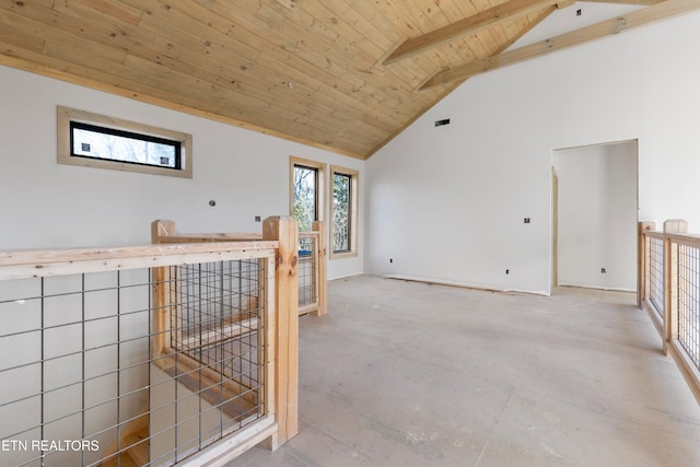 interior space featuring beamed ceiling, wooden ceiling, and high vaulted ceiling