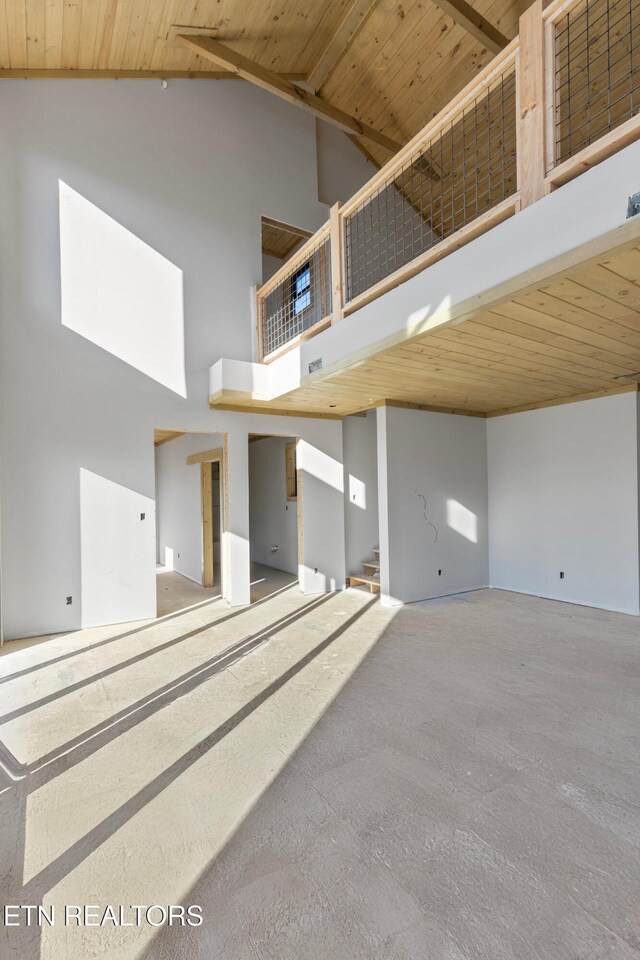 spare room featuring high vaulted ceiling and wooden ceiling