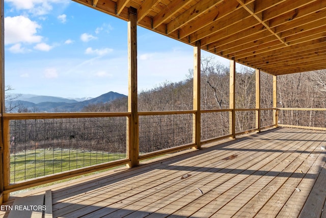 wooden terrace featuring a mountain view