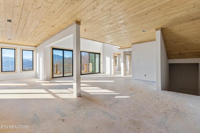 unfurnished living room with wooden ceiling