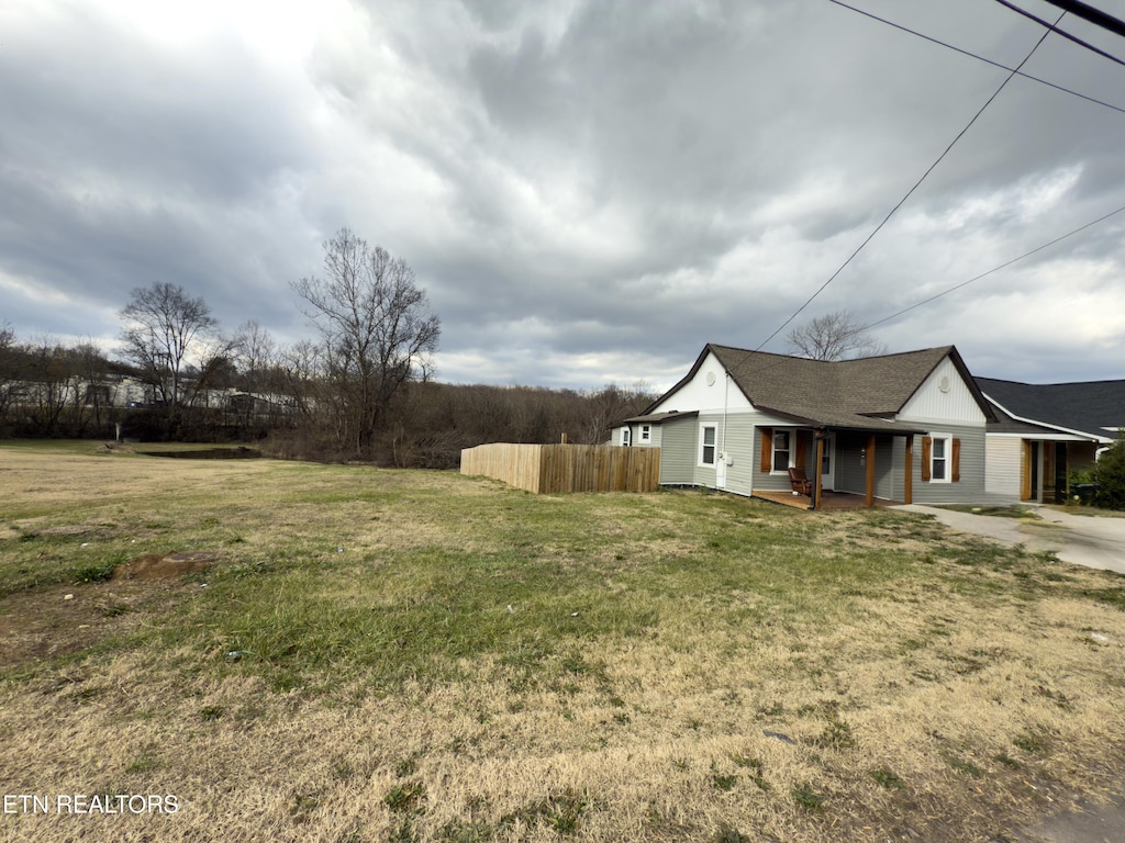 view of yard with covered porch