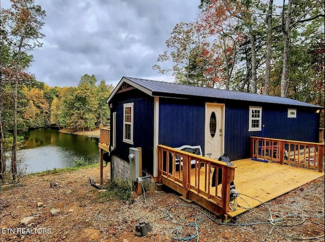 exterior space with a water view