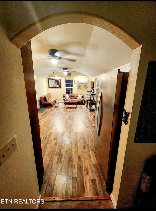 additional living space with vaulted ceiling, ceiling fan, and hardwood / wood-style flooring