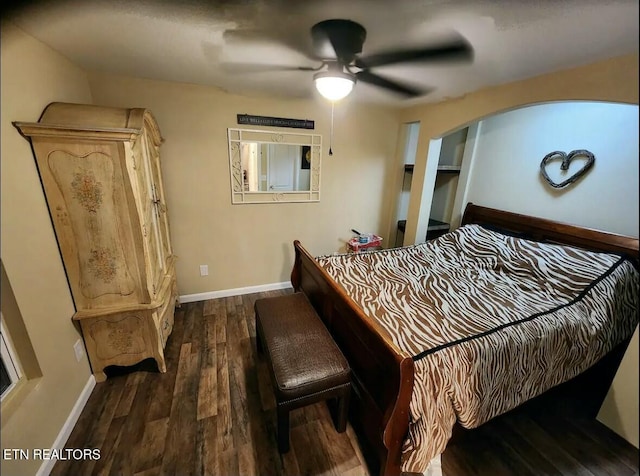 bedroom featuring ceiling fan and dark wood-type flooring