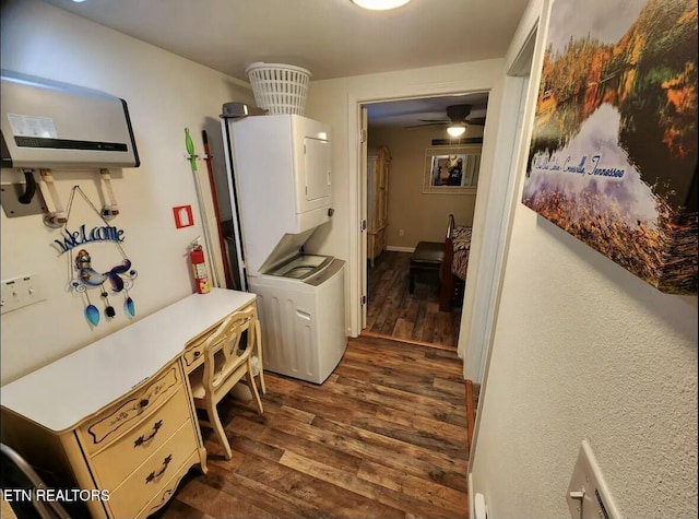 interior space featuring ceiling fan, stacked washer / dryer, and dark hardwood / wood-style flooring